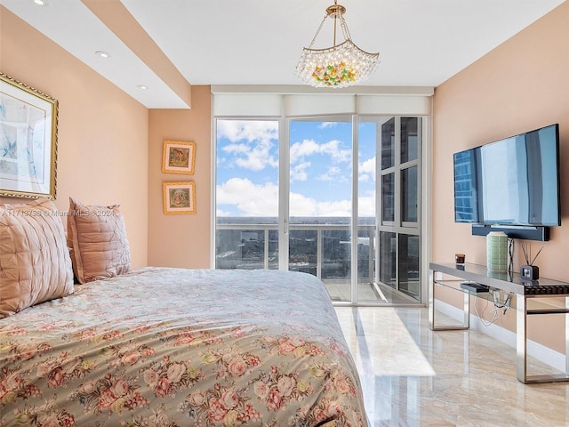 bedroom with floor to ceiling windows and access to exterior