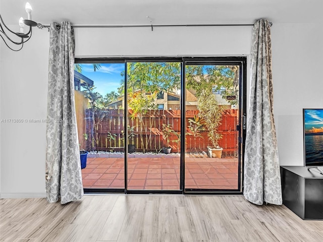 entryway with hardwood / wood-style flooring