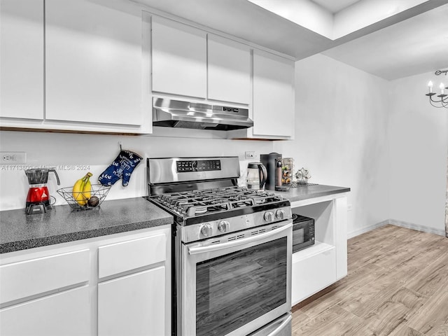 kitchen featuring white cabinets, a chandelier, light hardwood / wood-style floors, and stainless steel gas range