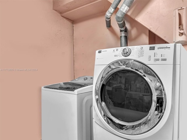 laundry room with washer and dryer