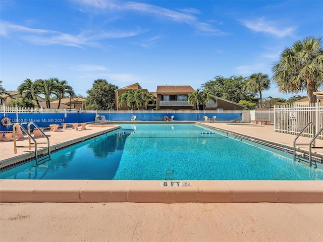 view of swimming pool featuring a patio