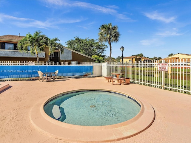 view of pool featuring a patio