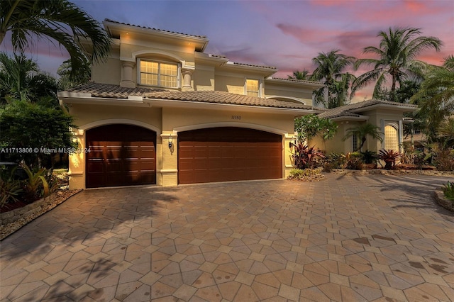 mediterranean / spanish-style home featuring a garage