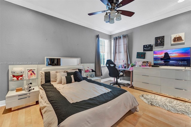 bedroom featuring ceiling fan, ornamental molding, and light hardwood / wood-style flooring