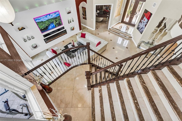 staircase with tile patterned floors