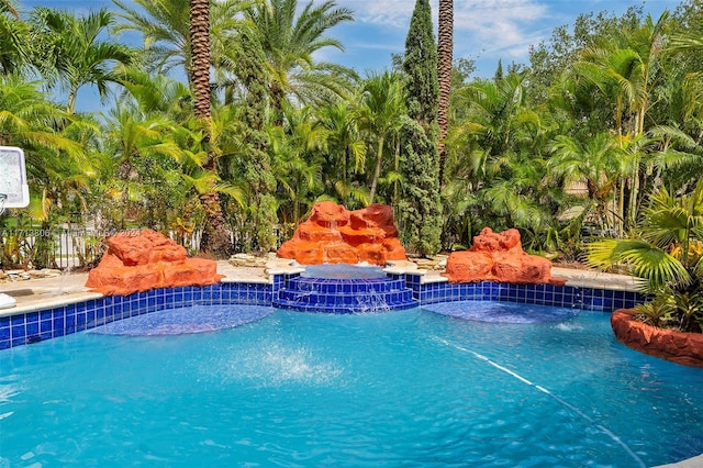 view of pool with pool water feature