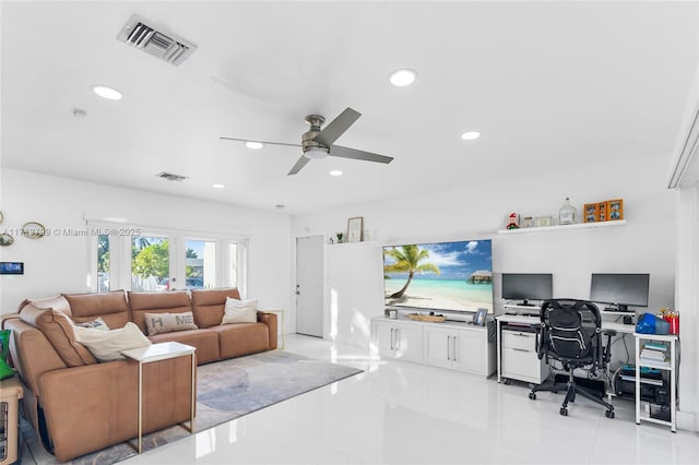 tiled living room with ceiling fan and french doors