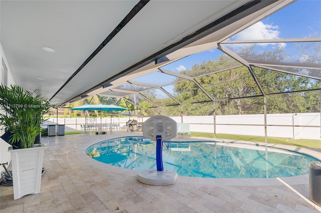 view of pool featuring a lanai and a patio