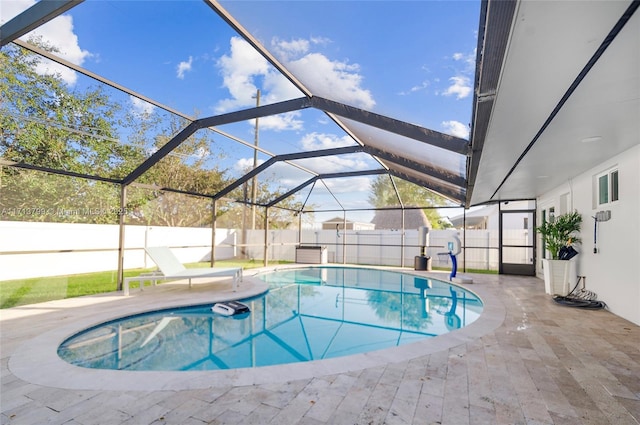 view of pool featuring a lanai and a patio area