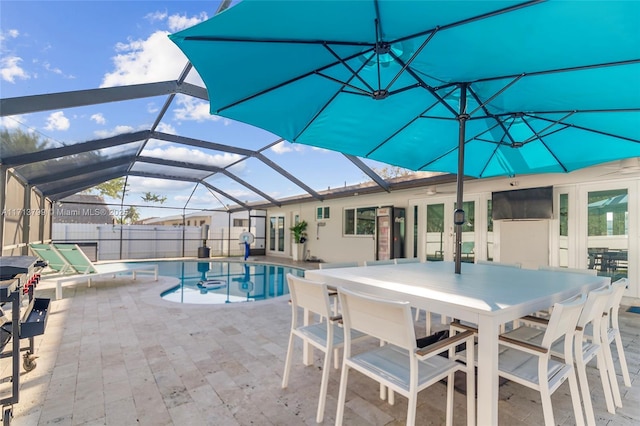 view of swimming pool with a patio area, a lanai, and french doors