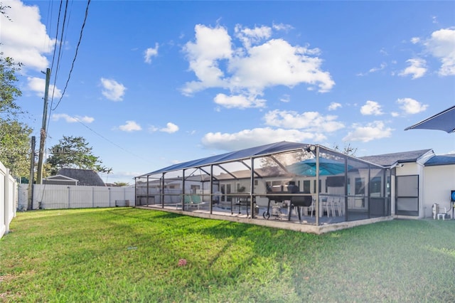 view of yard with a patio area and a lanai