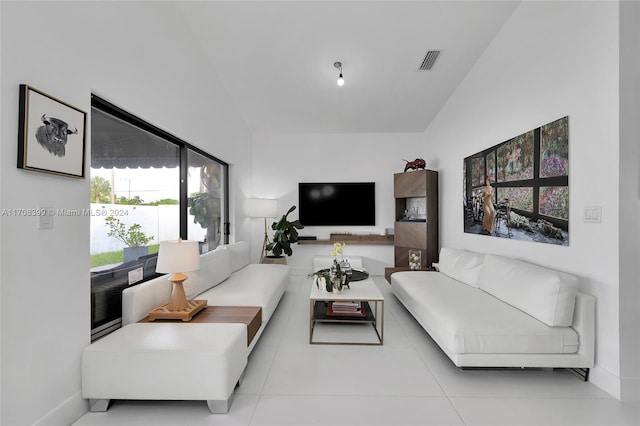 living room with light tile patterned flooring