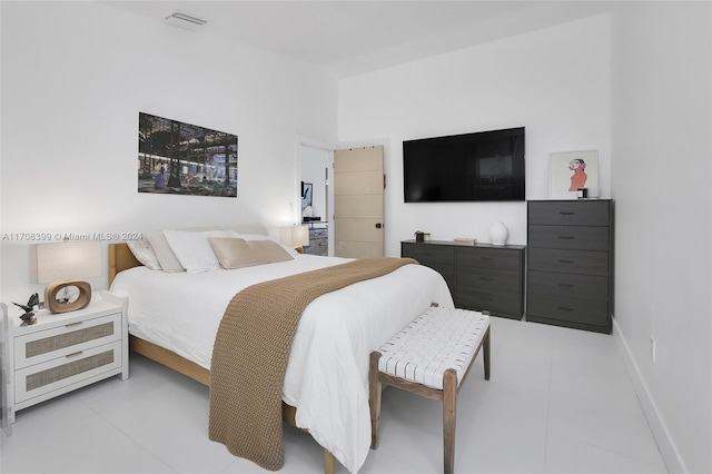 bedroom with light tile patterned flooring