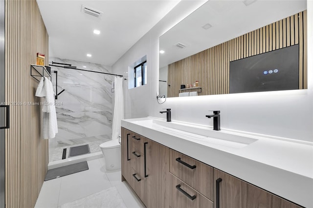 bathroom featuring tile patterned floors, vanity, curtained shower, and toilet