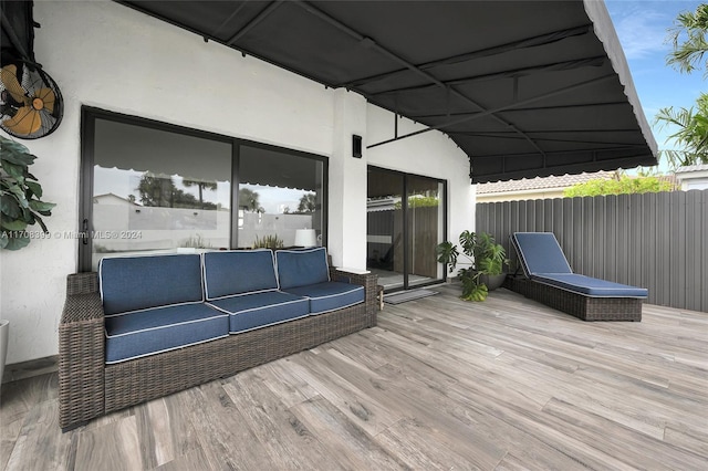 wooden deck featuring an outdoor hangout area