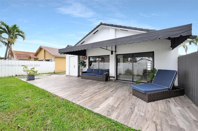 wooden deck with a lawn