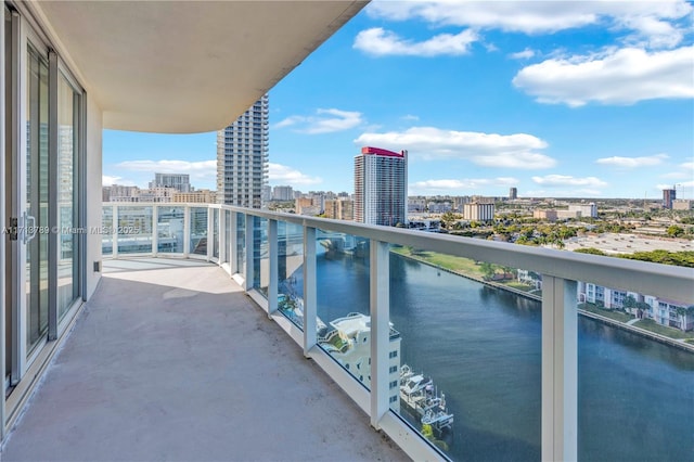 balcony featuring a water view