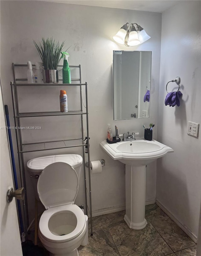 bathroom featuring toilet