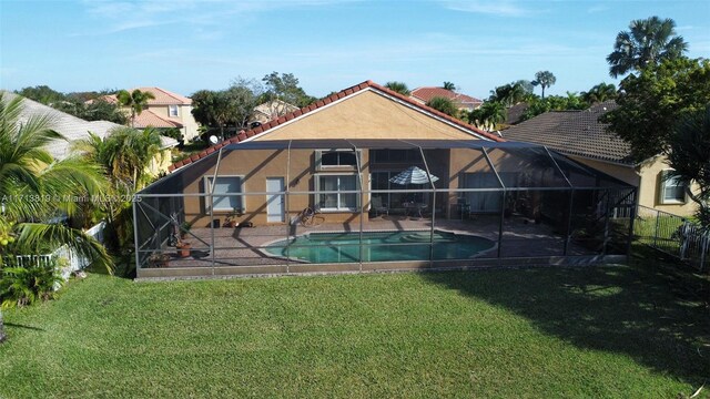 760 SW 190th Ave, Pembroke Pines, FL 33029 - back of house featuring a tile roof, a lawn, a patio, an outdoor pool, and stucco siding