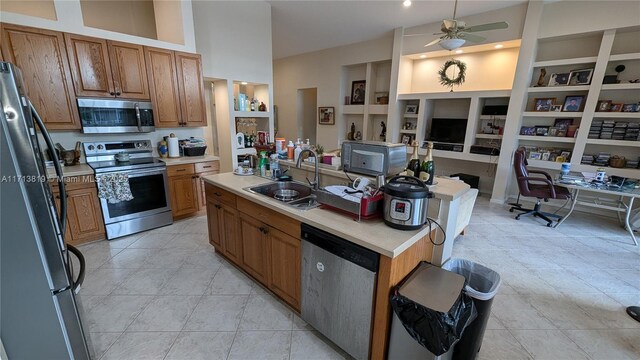 760 SW 190th Ave, Pembroke Pines, FL 33029 - kitchen featuring brown cabinets, light countertops, a ceiling fan, a sink, and black appliances