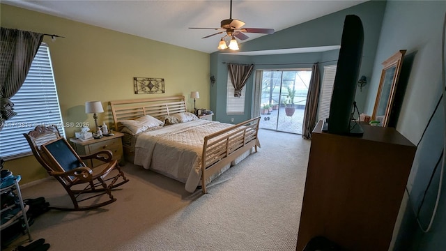 carpeted bedroom with access to outside, vaulted ceiling, and ceiling fan