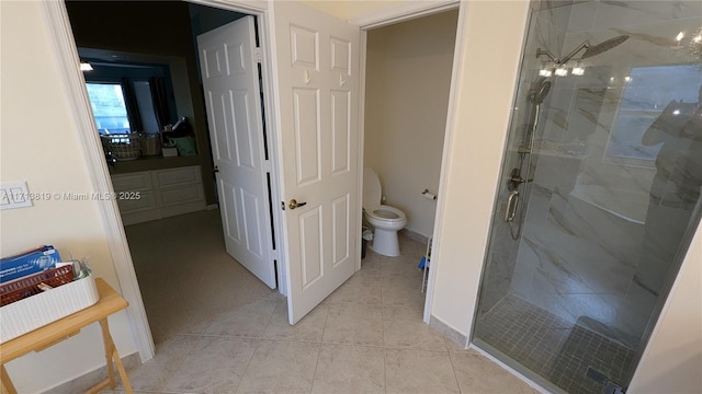 760 SW 190th Ave, Pembroke Pines, FL 33029 - bathroom featuring toilet, tile patterned flooring, a marble finish shower, and baseboards