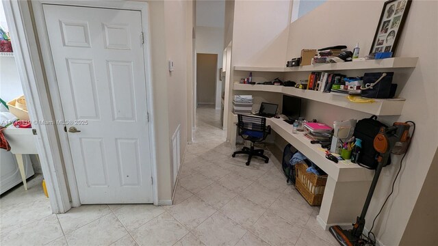 bathroom featuring vanity, a textured ceiling, tiled shower, tile patterned flooring, and toilet