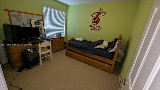 bedroom featuring light colored carpet