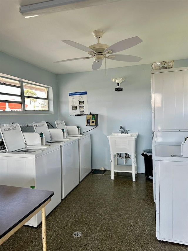 washroom with washer and clothes dryer, ceiling fan, stacked washing maching and dryer, and sink