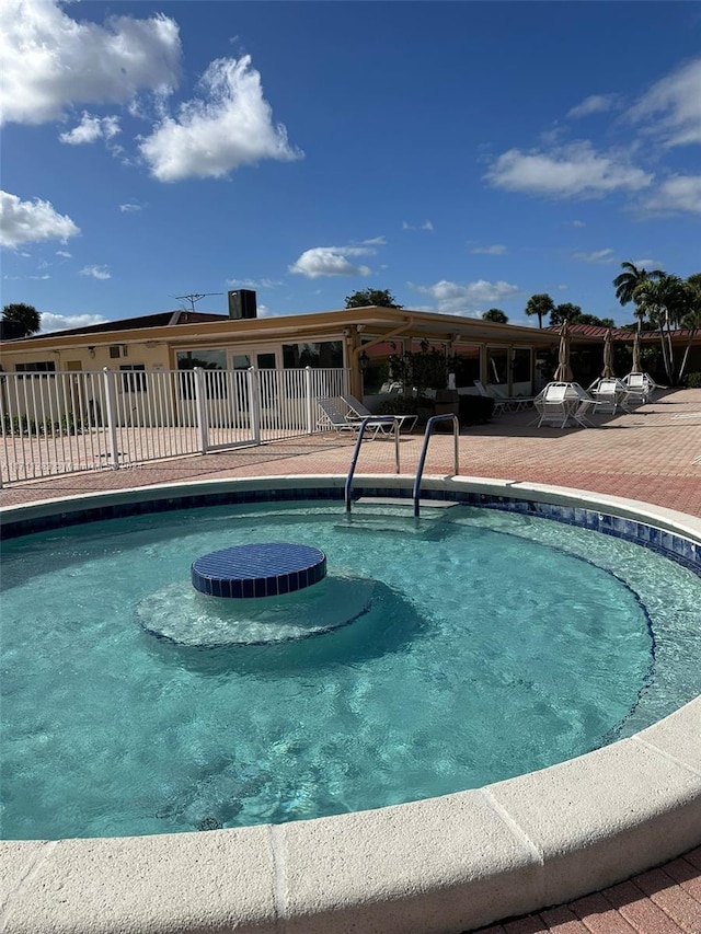 view of swimming pool with a patio area