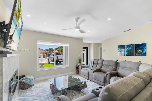 living room featuring hardwood / wood-style flooring and ceiling fan