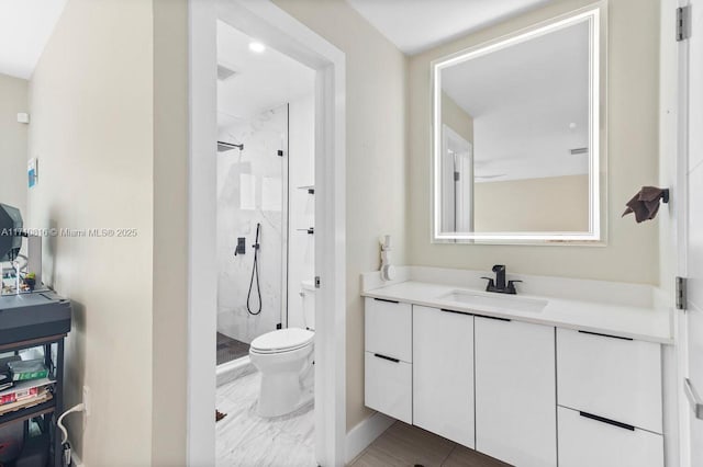 bathroom featuring walk in shower, vanity, and toilet