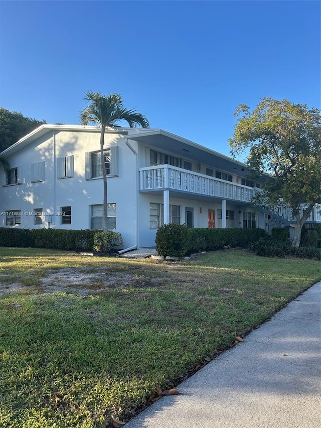 view of front of home with a front yard