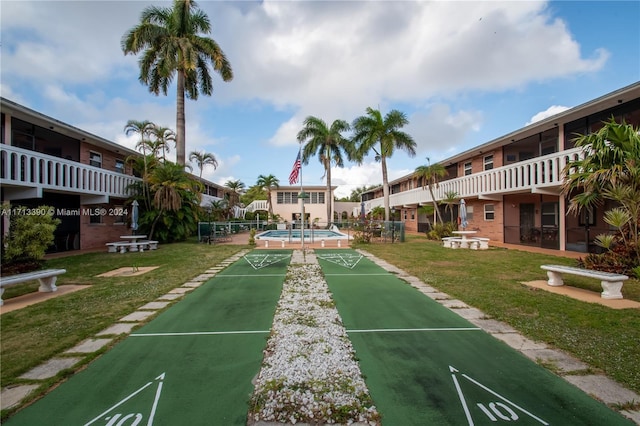 view of home's community featuring a lawn