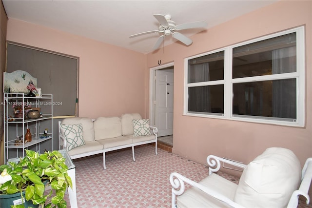 view of patio with outdoor lounge area and ceiling fan