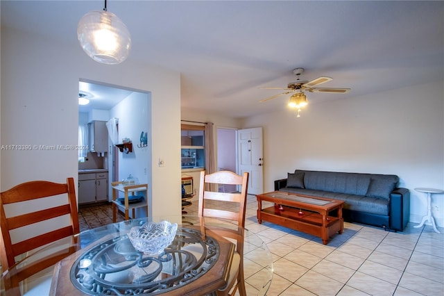 tiled living room with ceiling fan