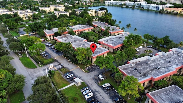 birds eye view of property featuring a water view