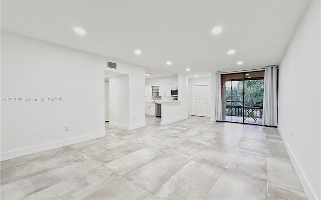 unfurnished living room with expansive windows