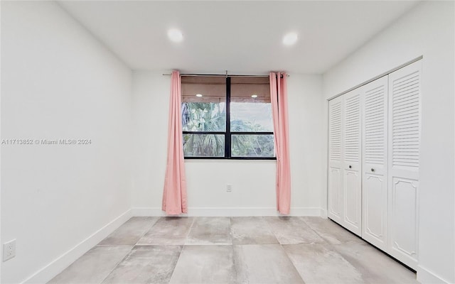 unfurnished bedroom with a closet