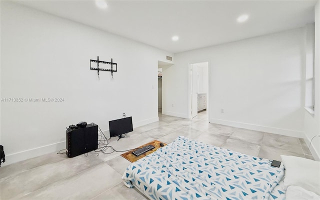 bedroom featuring connected bathroom