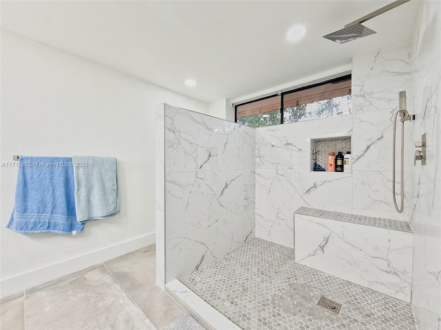 bathroom with tiled shower