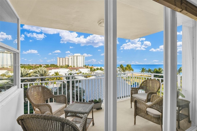 balcony featuring a water view