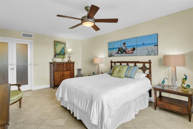 bedroom with ceiling fan and light tile patterned floors