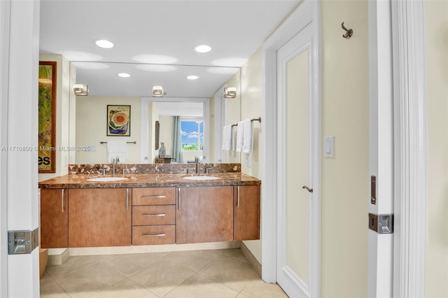 bathroom featuring tile patterned flooring and vanity