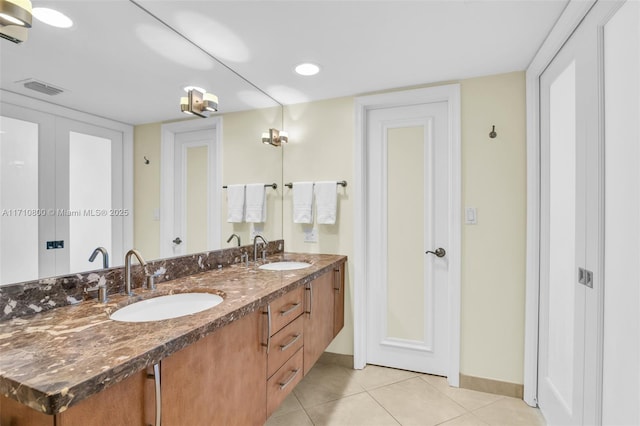 bathroom featuring tile patterned floors and vanity