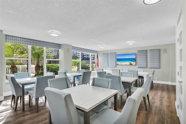 dining area with a textured ceiling, floor to ceiling windows, and dark wood-type flooring