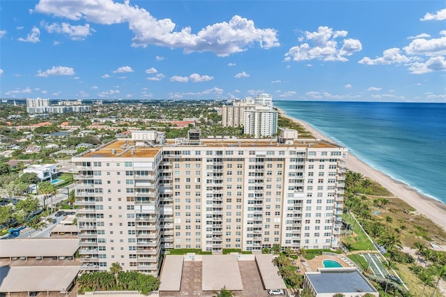 bird's eye view featuring a water view and a beach view