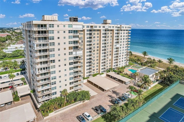 view of property featuring a view of the beach and a water view