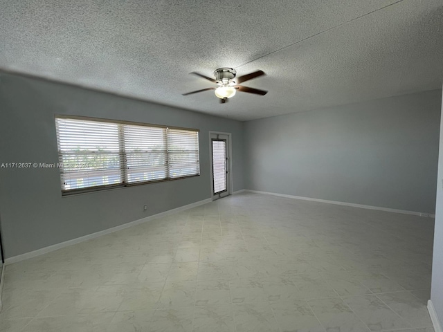 unfurnished room with ceiling fan