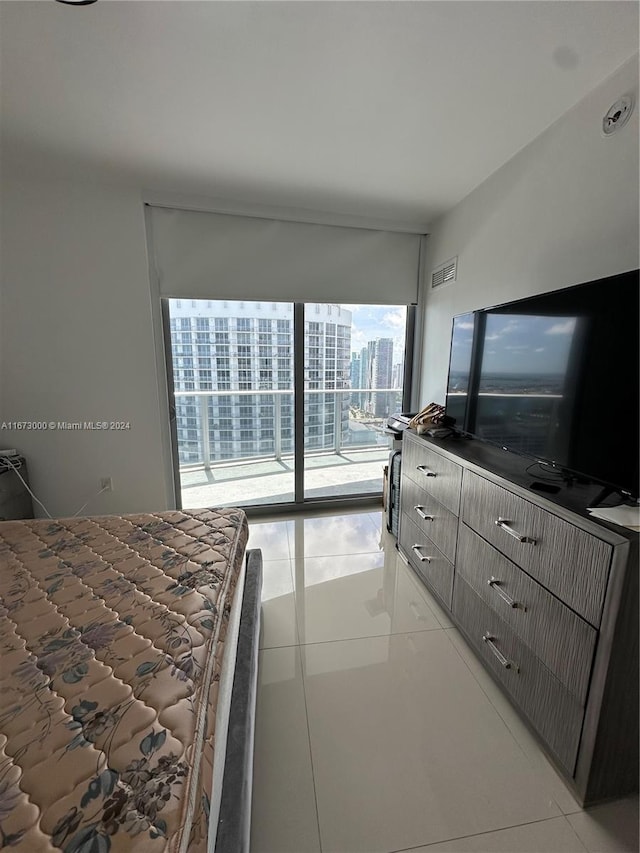 tiled bedroom featuring access to exterior